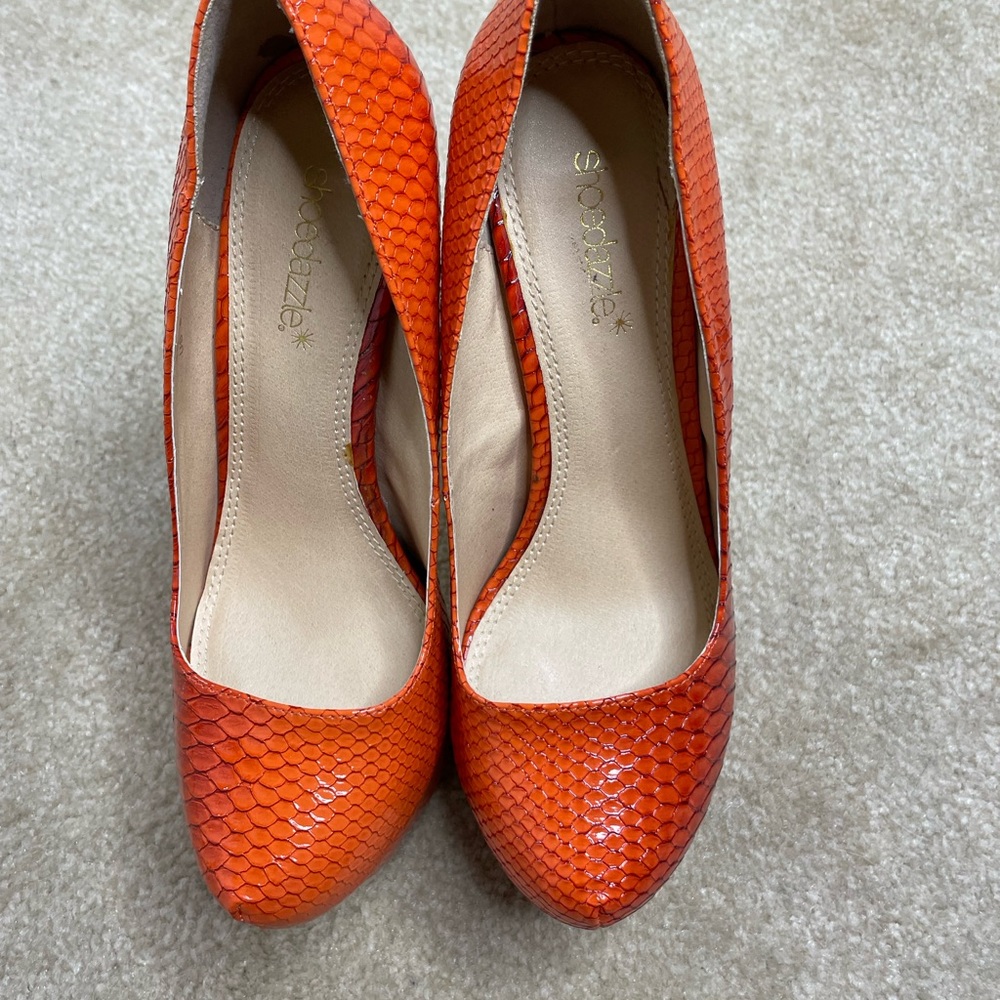 Worn once…cute orange snakeskin 6 1/2 inch platform heels.